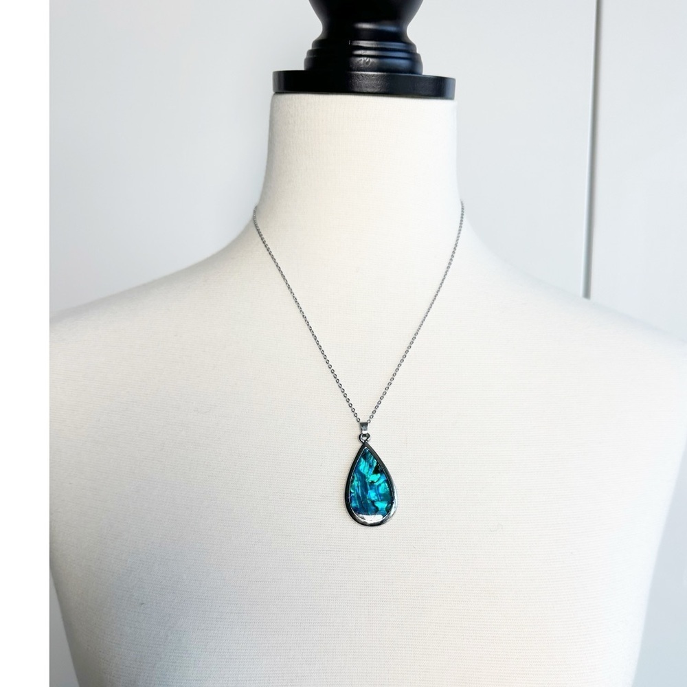 teardrop pendant necklace featuring an iridescent Paua shell inlay Silver Toned